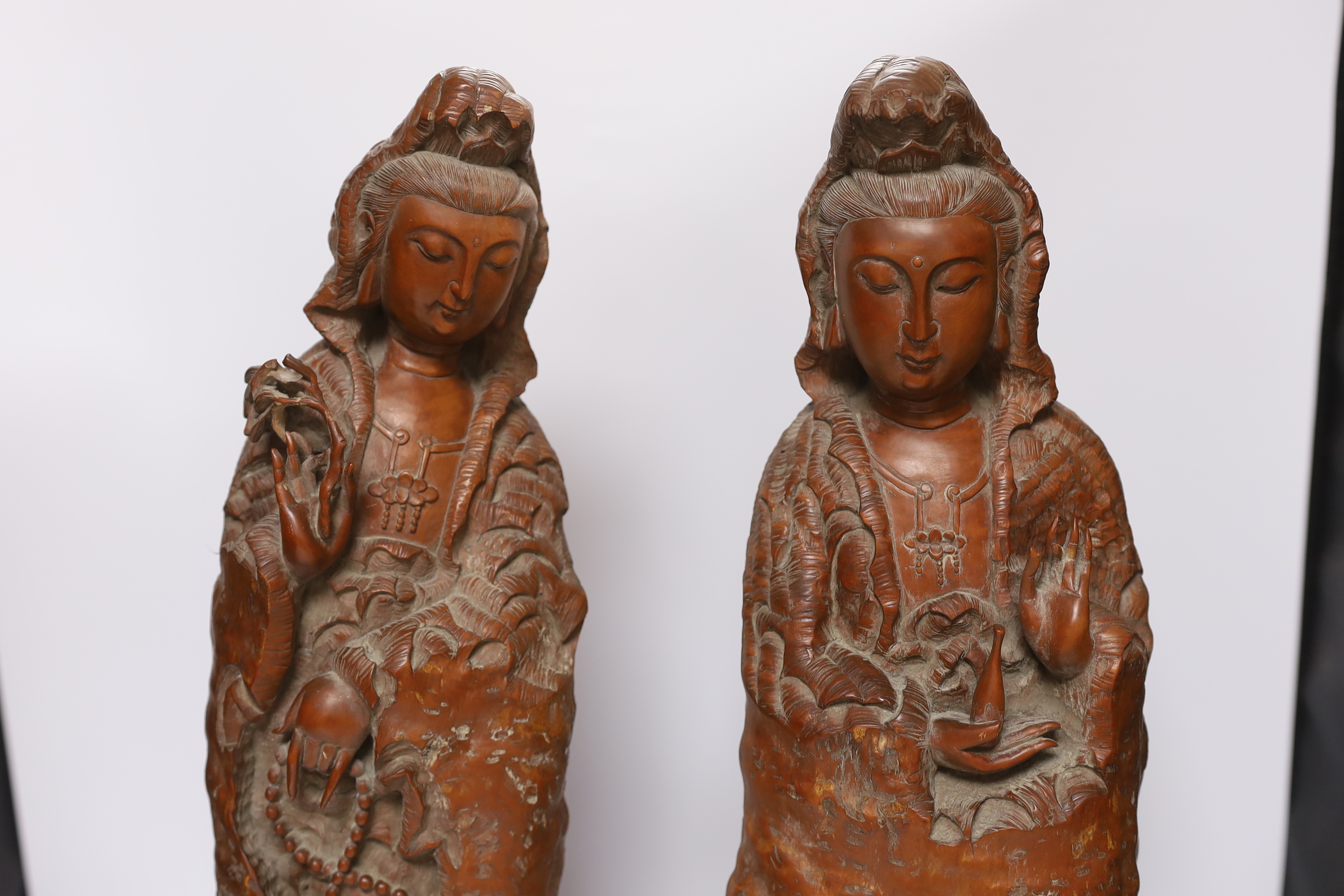 Two large Chinese rootwood figures of Guanyin, 57cm high